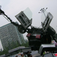 Illustration for article titled VW Passat-a-Bot Transformer Attacks Beijing Mall